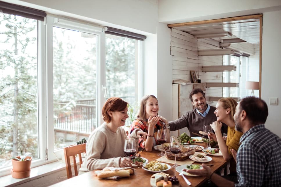 Family enjoying a holiday meal at the dinner table